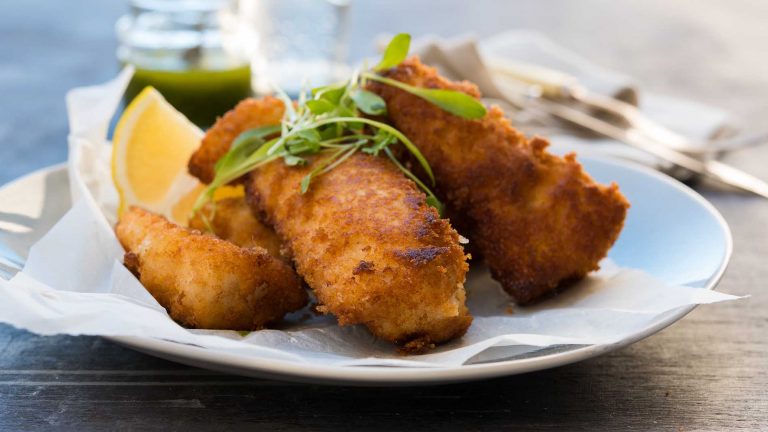 Image of the flathead fillets being dished with dressing
